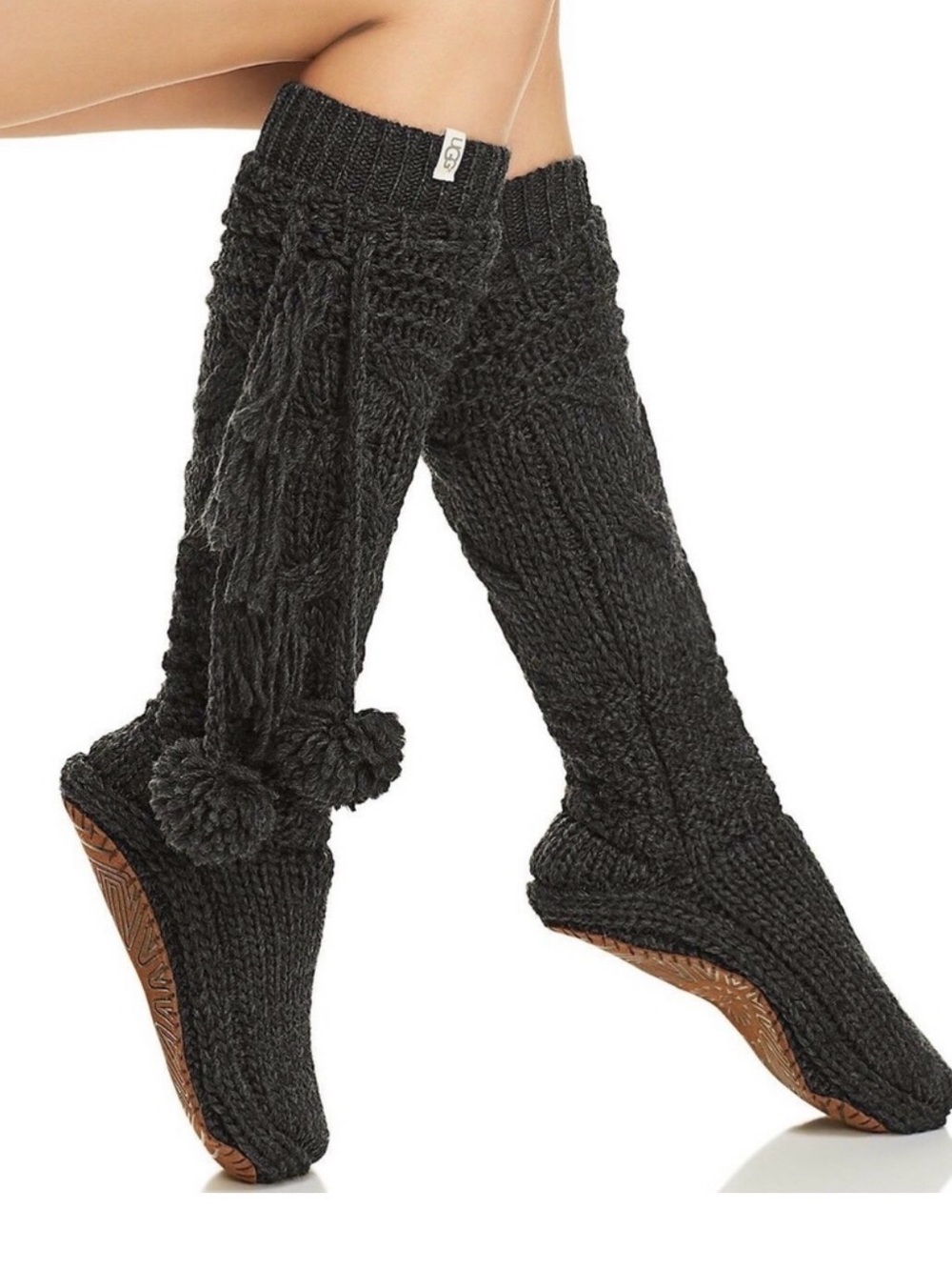 UGG cable-knit pom-pom slipper socks
NWOT -purple